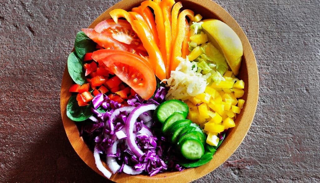 picture of bowl filled with fresh veggies and greens