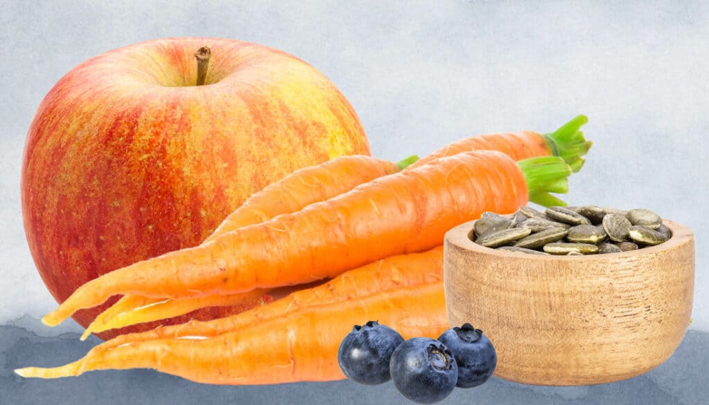 picture of apple, carrots, pumpkin seeds, and blueberries