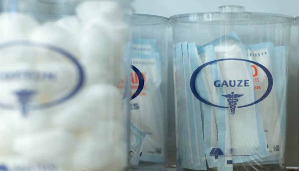 picture of containers of gauze and cotton balls