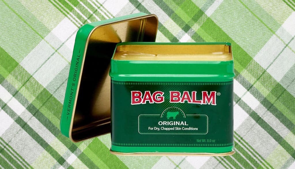 tin of bag balm on a green plaid background