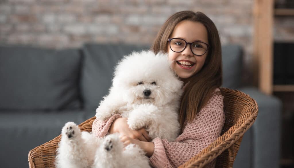 girl with bichon frise