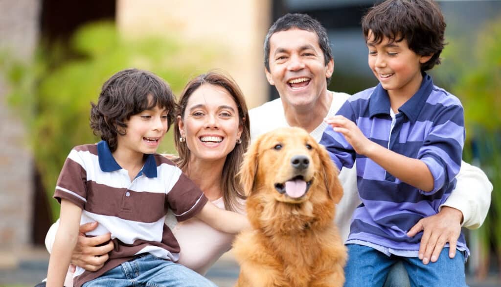 healthy dog with their family happy and clean
