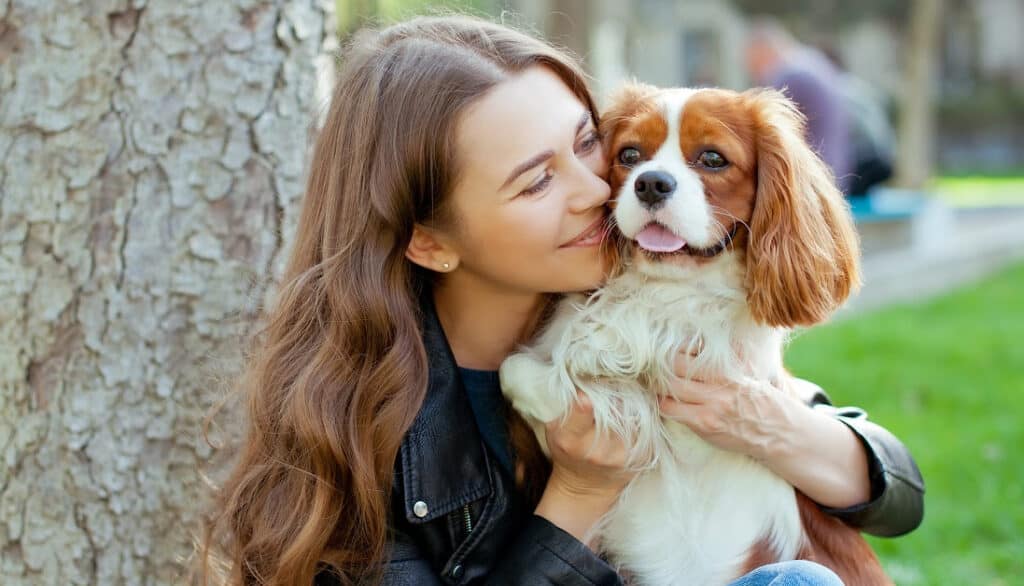 girl with happy king charles cavalier