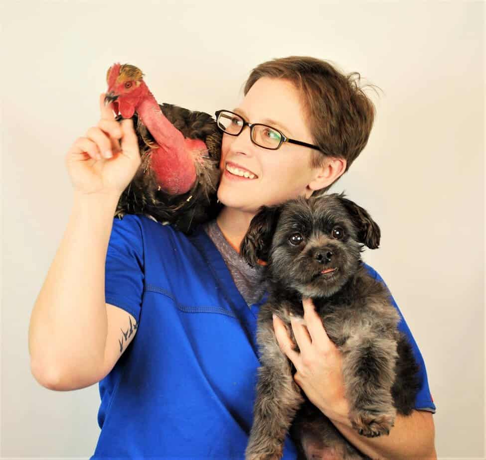 Lindsie Parks smiling with a dog and turkey